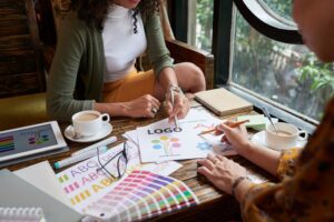 Cropped image of designer and client meeting in cafe